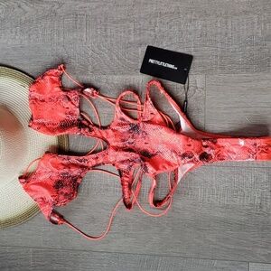 NWT Pretty Little Things Monokini. Bright orange dragonskin. Size 2